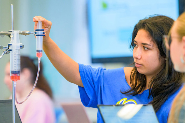 Assistant Professor of Physics and Astronomy Ilia Gogoladze teaching a section of SCEN101: Physical Science during a Center for Teaching and Assessment of Learning (CTAL) open teaching day.