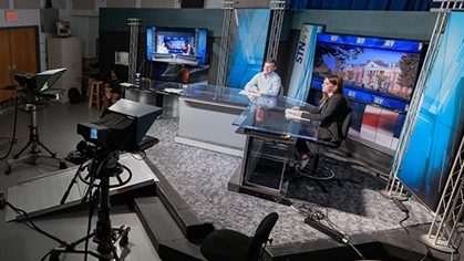Students in the STN 49, University of Delaware Student TV studio in Pearson Hall. As part of the Department of Communications, the television studio serves as the set for student-produced bi-weekly news programs carried on local cable TV.