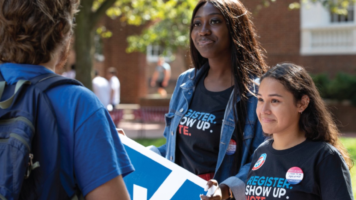 Students participating in a register to vote event.