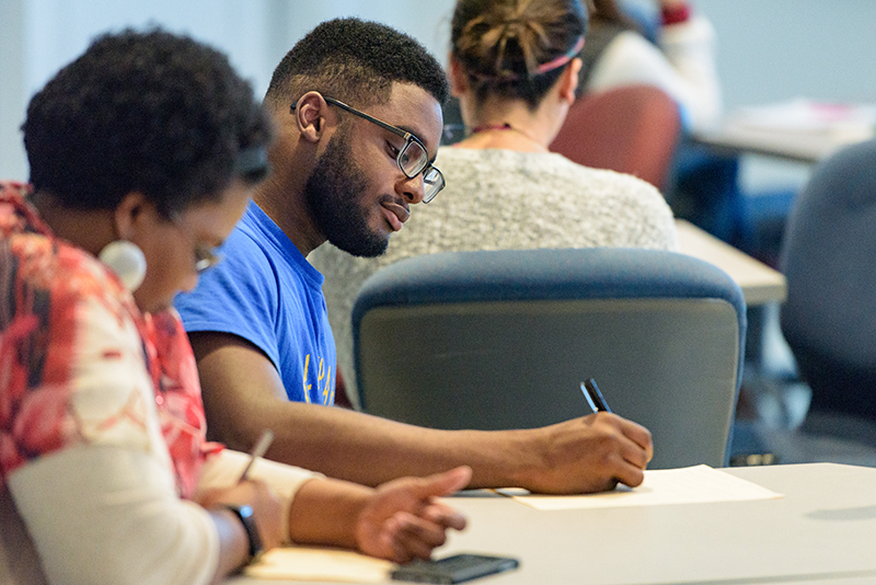 University of Delaware students take notes during an anthroplogy class