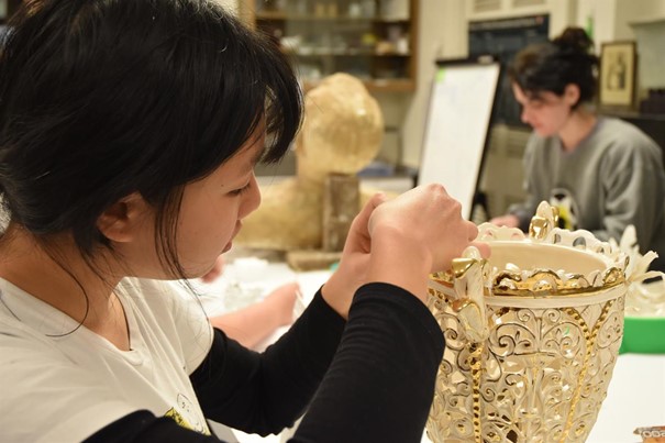 Shi Kin Tan (UD ’22) and Anne Clark (X’24) treat ceramic objects in a conservation treatment course. (Image: Madeline Hagerman, University of Delaware)