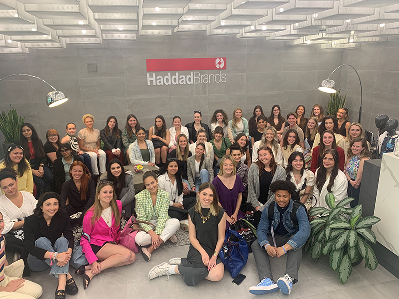 Group of students participating in fashion themed bus trip