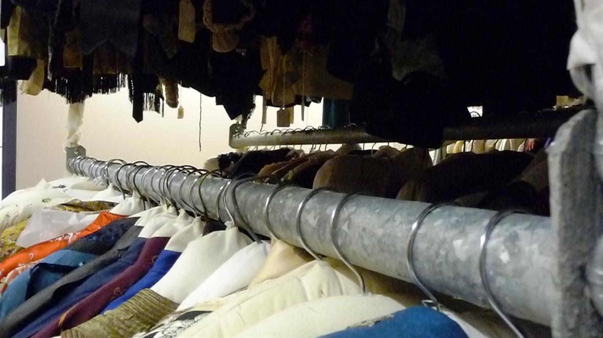 Clothing on hangers closeup hanging on rack