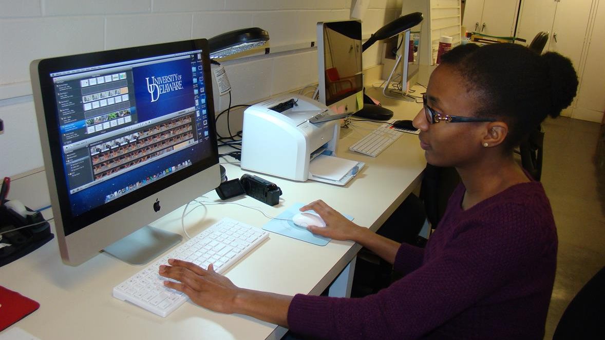 Female graduate student working at a computer