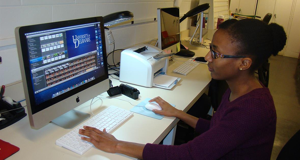 Female graduate student working at a computer
