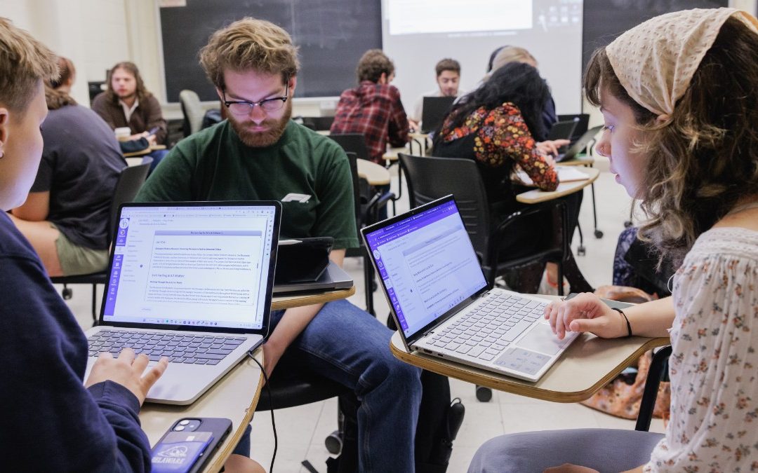 Professor lecturing in classroom students looking engaged