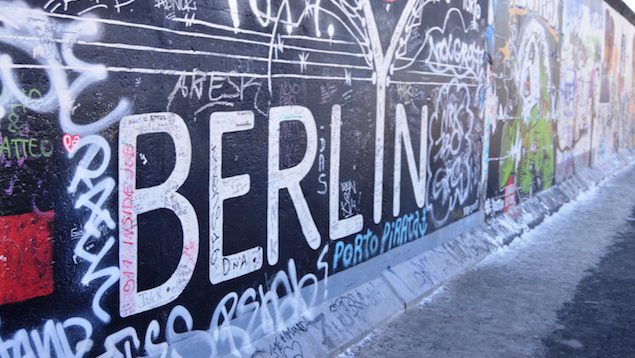 Grafitti on a wall that says Berlin