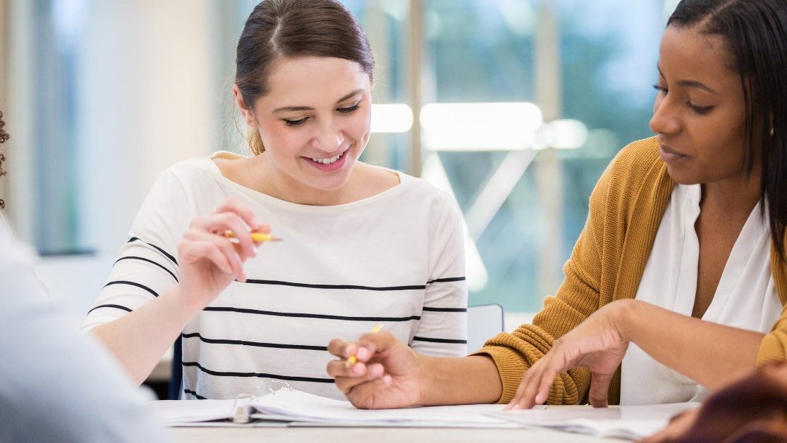 A photo of young women studying math