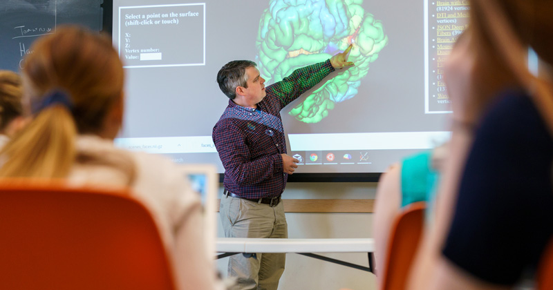 Tim Vickery, associate professor of Psychological and Brain Sciences, teaching a section of a two-week 