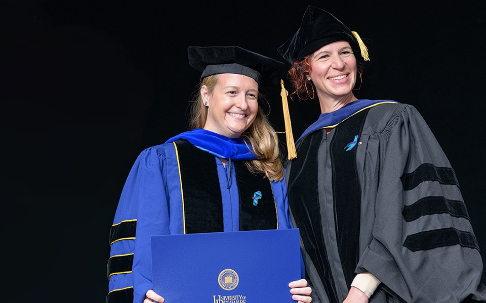 Graduate College Convocation and Doctoral Hooding Ceremony on May 26, 2022, for the Class of 2022. Jamie Lee Manzer [Sociology] B.A., Colby College Professor in charge of dissertation: Ann V. Bell Ph.D.Dissertation: " 'You’re Planning a Family, Not Just a Pregnancy': The Meanings, Experiences, and Uneven Burdens of Family Planning in Women’s Lives."