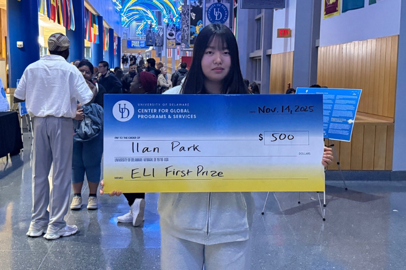 Ilan Park International Essay Contest Winner pictured with her $500 prize check.