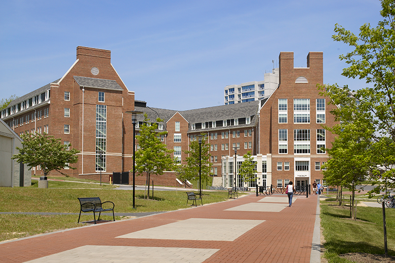 A large red brick dormitory on a college campus.