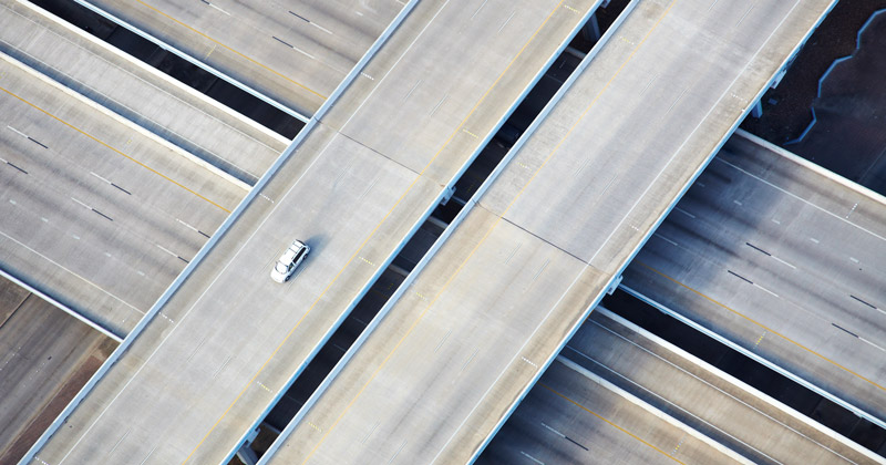 Image of a car on a freeway, all by itself