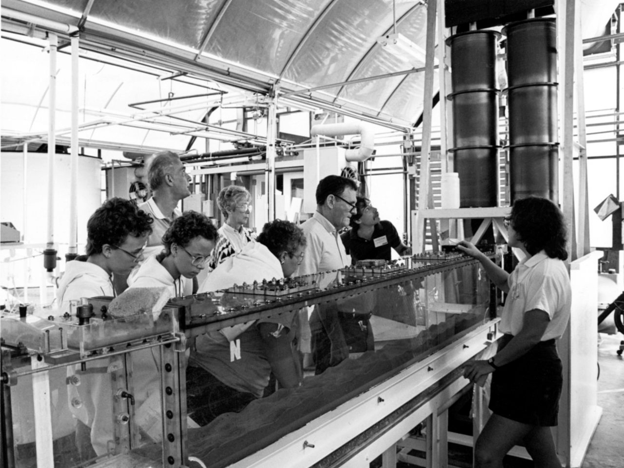 1970s-era photo of students inspecting a water tank