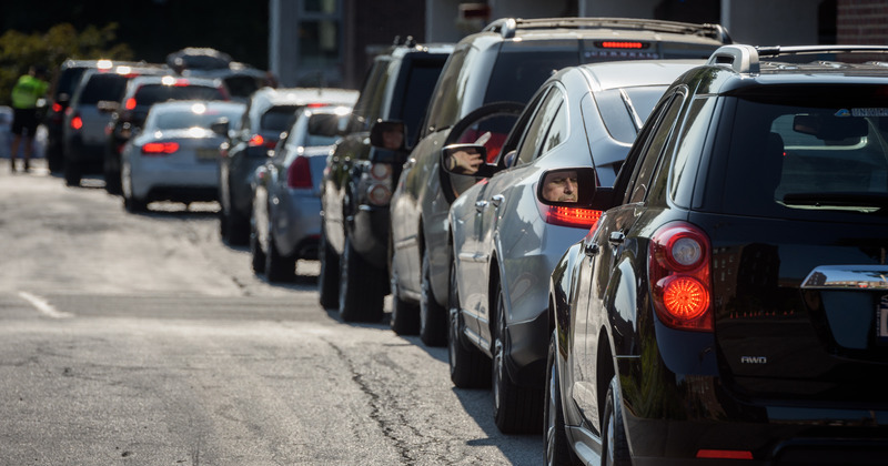 A line of cars waits to pull up the Harrington Residence Complex and Perkins Student Center parking garage during 1743 move-in days, August 26th, 2017. - (Evan Krape / University of Delaware)