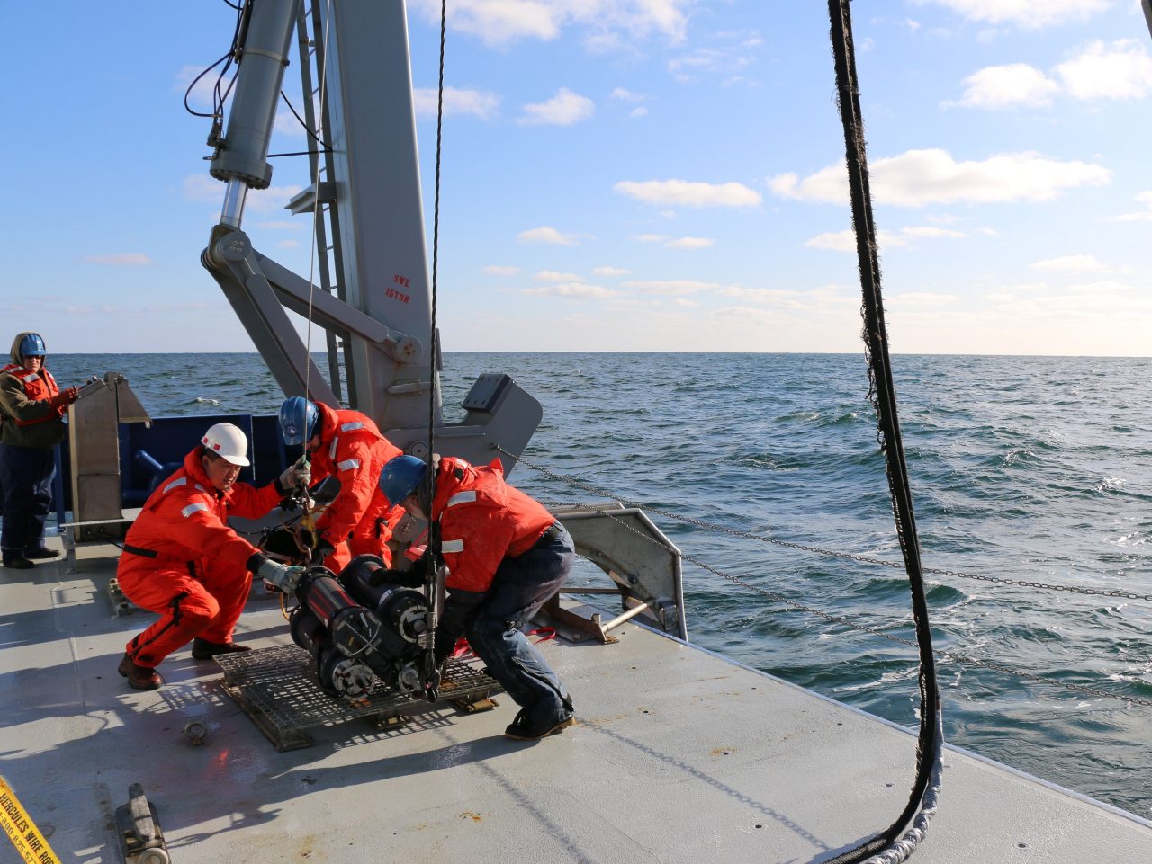 UD scientists preparing to deploy acoustic instruments off stern of research vessel