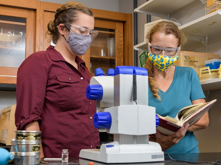 Grad student and faculty member in lab