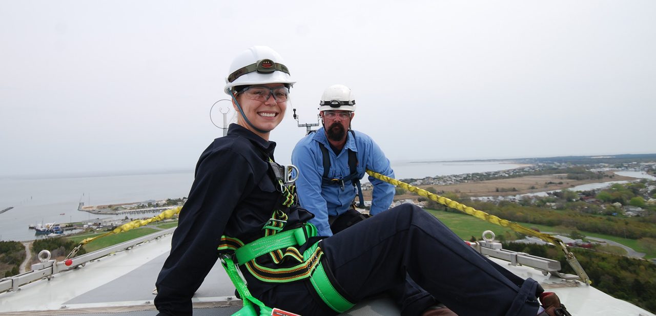 Graduate student posing atop the turbine 