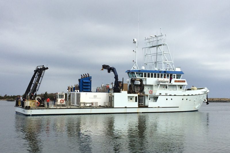 R/V Sharp with reflection rippled in water