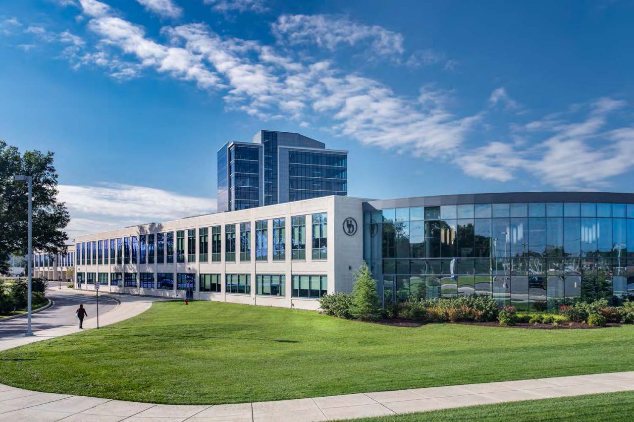 External photo of the Health Sciences Complex with the Tower at STAR in the background