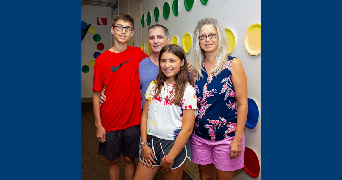 Camp attendee Sophia smiles with her mom, dad and brother at the Diabetes Kamp for Kids