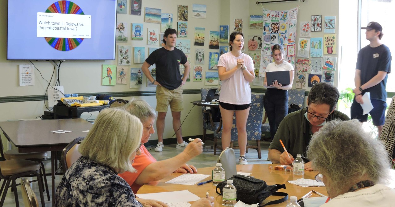 Four students lead an organized bingo event 