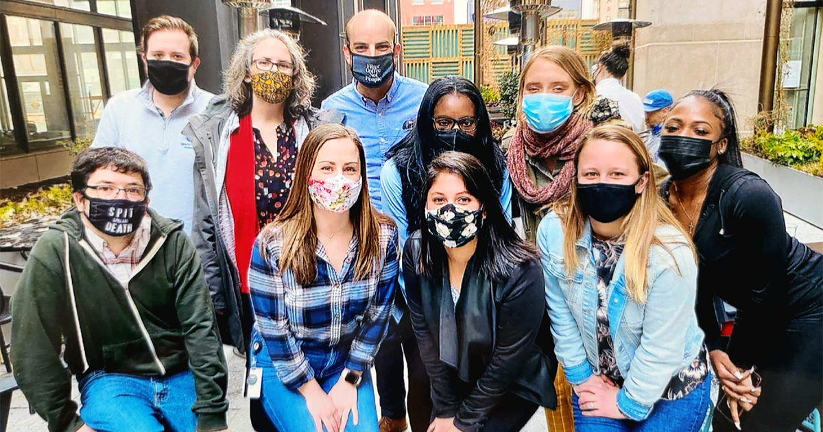 Colten Strickland and his team at the Philadelphia Department of Public Health pose all with masks on. 