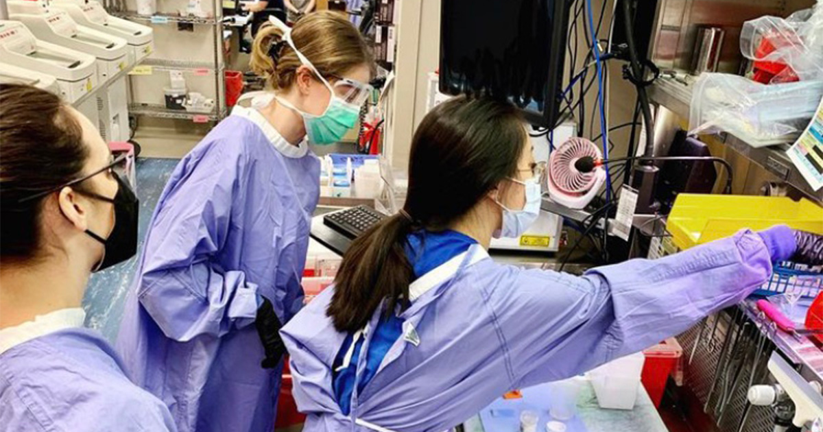 College of Health Sciences alumna Jessica McMahon (middle) teaches residents in a lab setting.