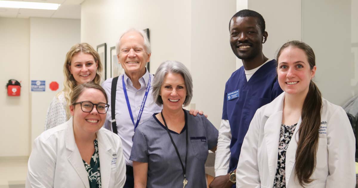 Web Group of nursing students, healthcare theatre actors, and pharmacy residents gather for a group photo
