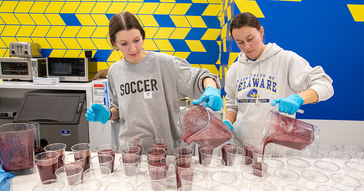 Nutrition and Dietetics majors pour Purple Power smoothies, a fan favorite on Thirsty Thursday, for athletes.