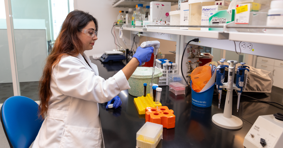 Female student experiments with medical science equipment