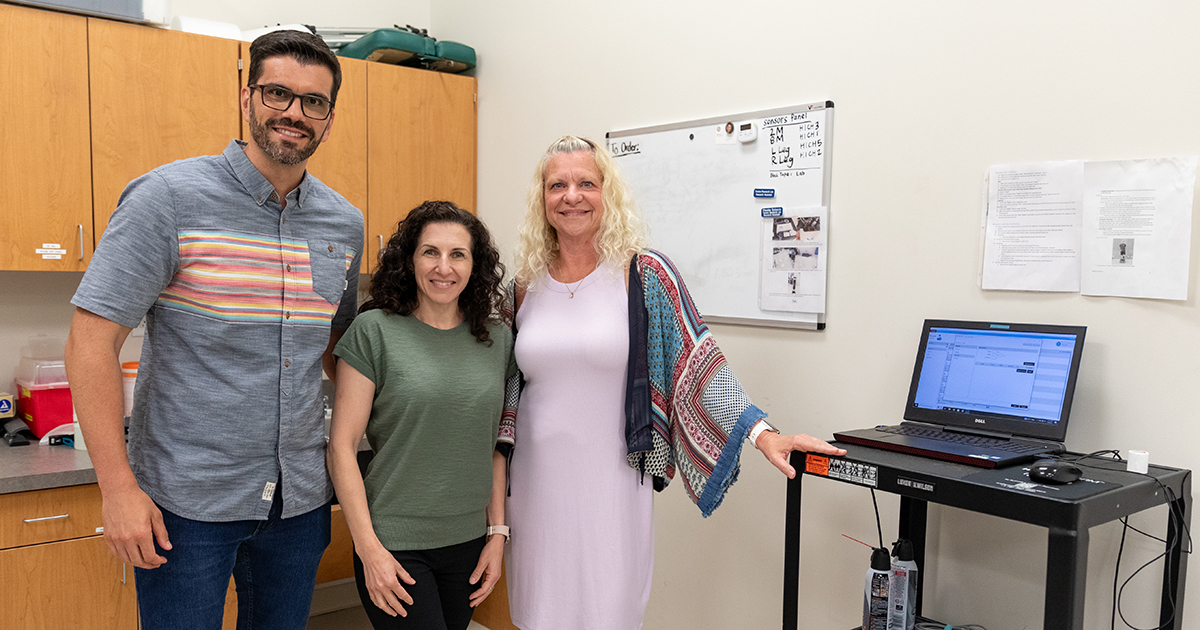 Husband and wife researchers from the  University of Brasília pose with Karin Grävare Silbernagel, associate chair and professor of physical therapy, in her tendon research lab on STAR Campus.
