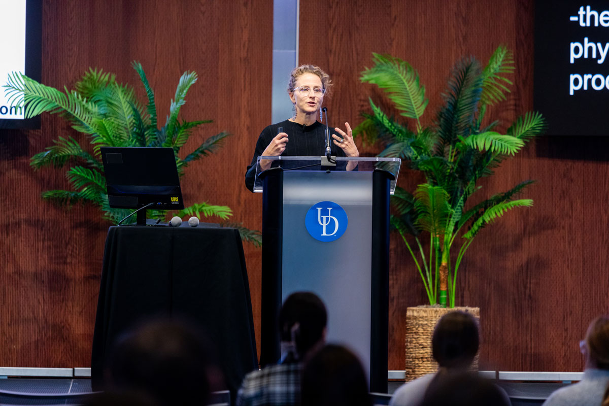 keynote speaker Josiane Broussard, director of the Sleep and Metabolism Lab and associate professor of health and exercise science at Colorado State University, talks about her research into sleep and circadian rhythm disruption and cardiometabolic impacts. at a podium in the Audion in STAR Tower..