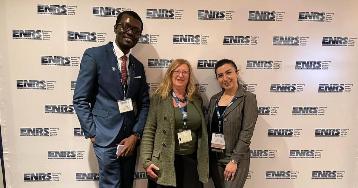 ENRS Event Three students posing at an event