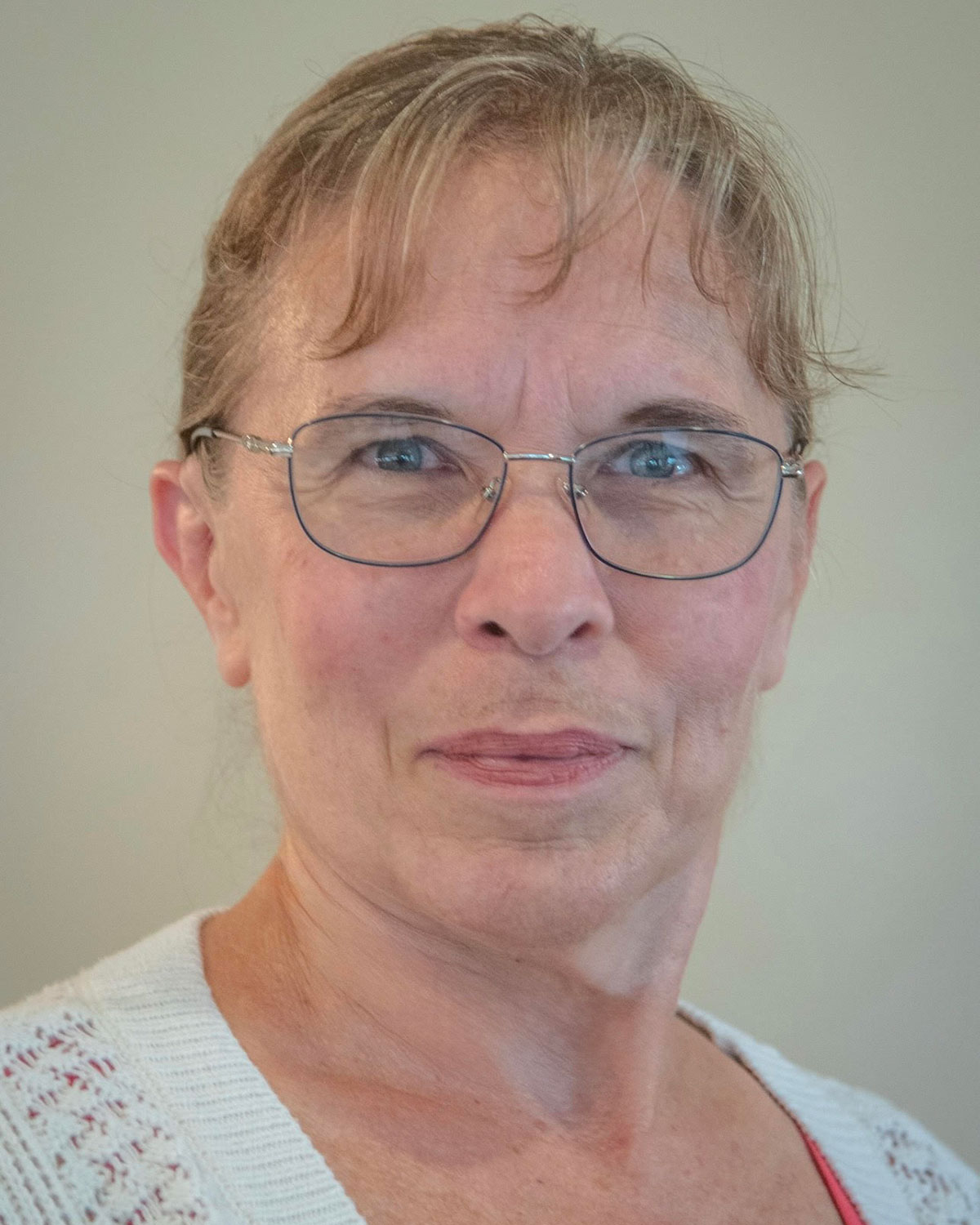 A headshot of new Medical and Molecular Sciences Instructor Wendy White with her hair pulled back.