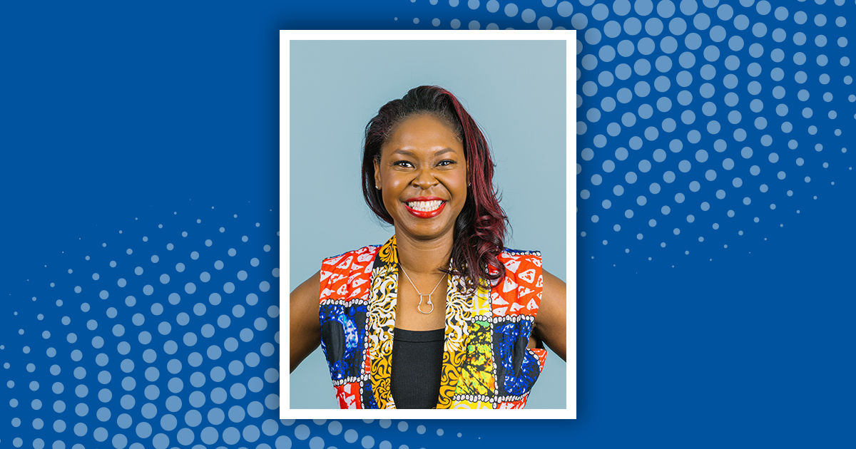 A headshot of Maya Clark-Cutaia with a blue background