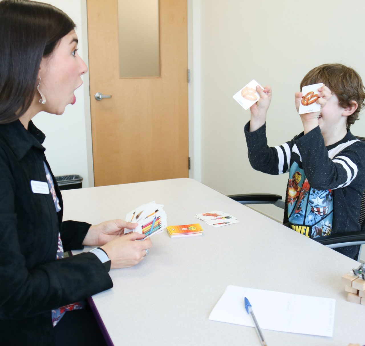 CHS UD Health Speech Language Hearing Clinic UD SLH clinician interacting with child in clinic using props