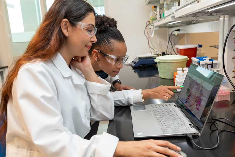 MMS Ph.D. students Senem Cevik and Jazzlyn Jones conduct research in the AP Bio building on STAR Campus.
