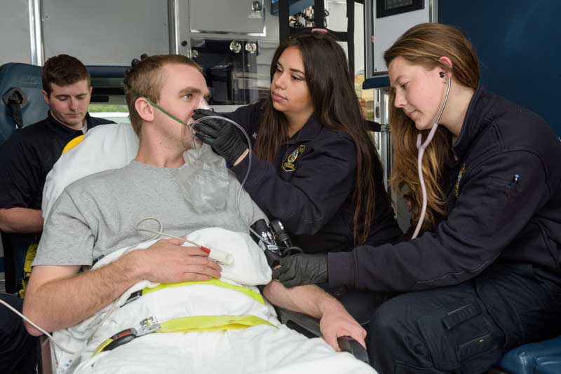 Students working as EMTs