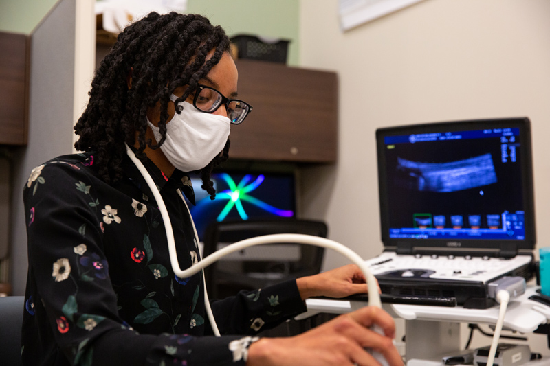 Student using an ultrasound machine