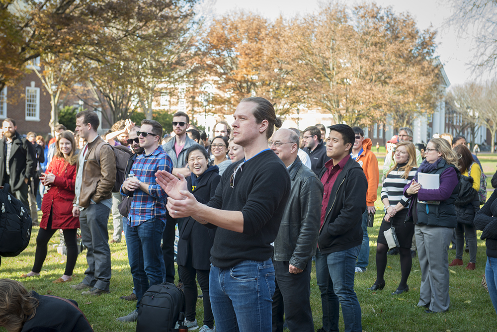 Graduate Students standing on the Green for a rally raising awareness for how a tax reform would impact graduate students.