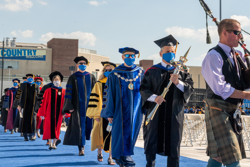 Hooding ceremony for 2020 and 2021 Doctoral Candidates, held on May 27th, 2021 in Delaware Stadium under the direction of UD President Dennis Assanis and Lou Rossi, Dean of the Graduate College and Vice Provost for Graduate and Professional Education.