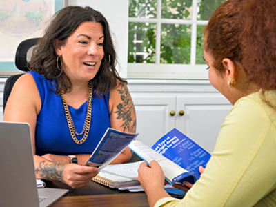 Student in discussion with staff memeber about fellowships
