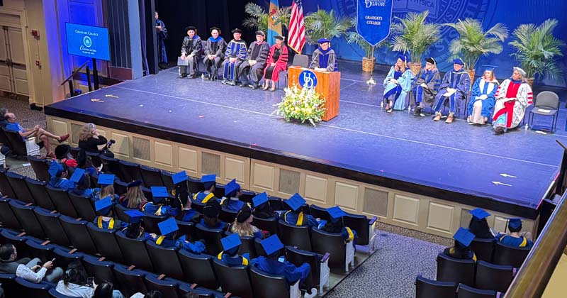 Keynote speaker Tom Powers addresses the 2025 graduates and their family and friends.