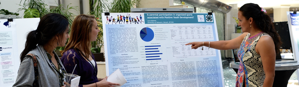 Woman presenting at a research symposium