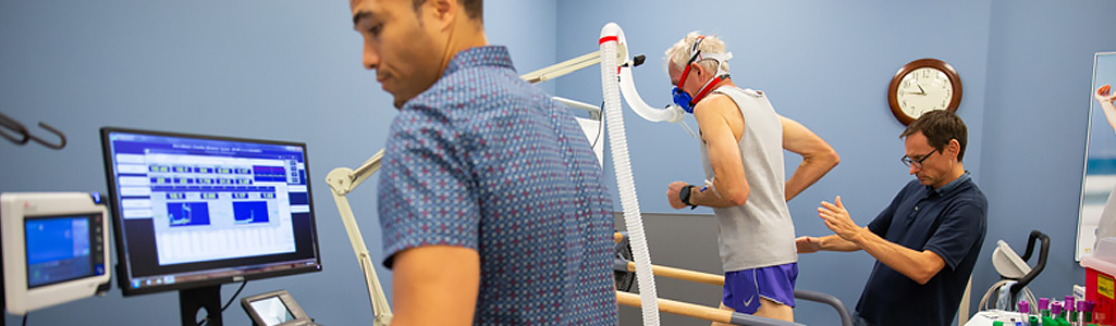 Clinical Exercise Physiology Student taking blood pressure in clinical exercise physiology lab.