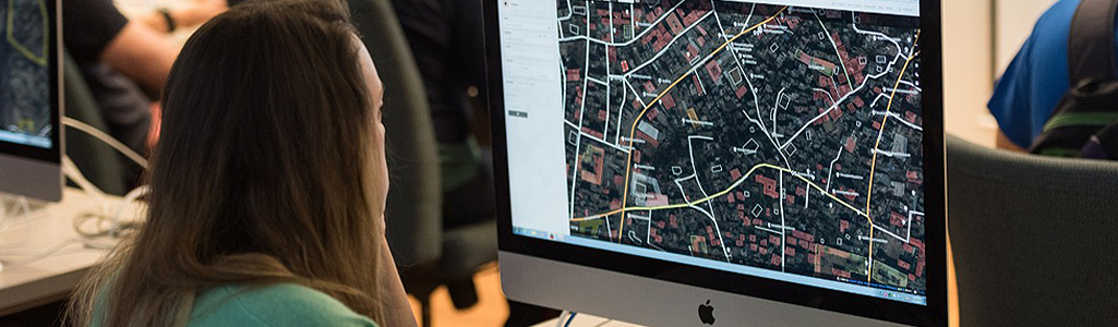 Georgraphy A student works on a mapping project on a computer.