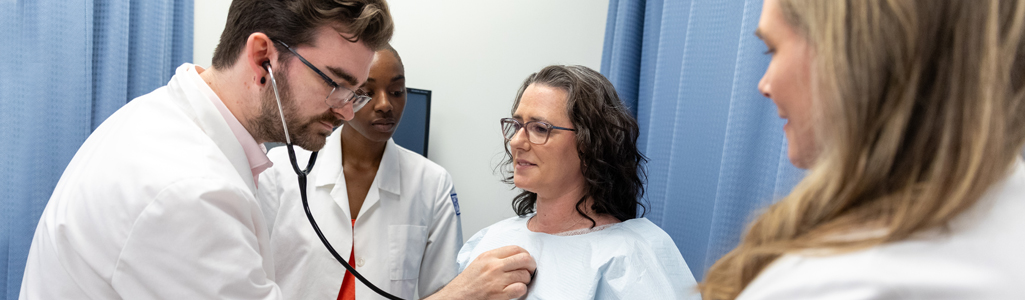 Nursing professor mentors a junior faculty member on some collaborating research for the College of Health Sciences.