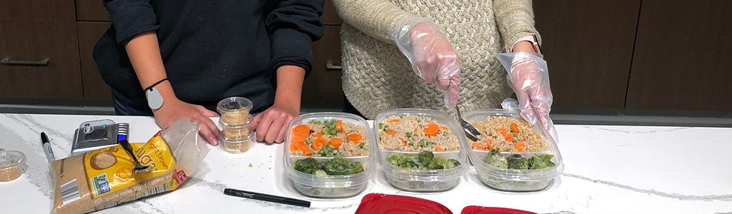 Graduate students prepare food in UD's Nutrition Lab.