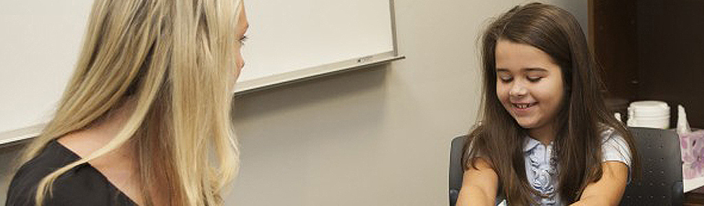 School Psychology Student conducting a school psychology assessment.